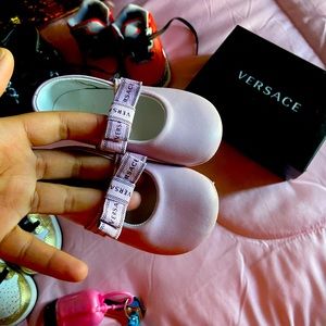 pink baby girl Versace shoes, they are worn once for a non walking baby.